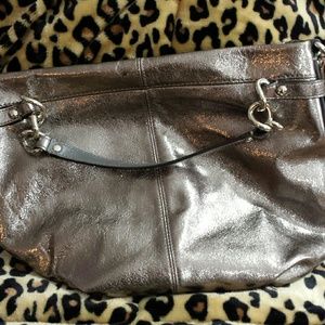 Coach used twice smells new