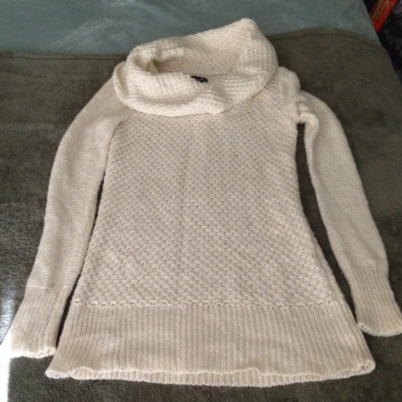 Long turtle neck cream sweater.