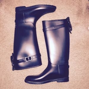 Dirty laundry black rain boots.