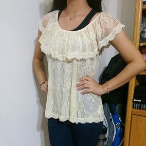 Nice laced cream colored shirt.