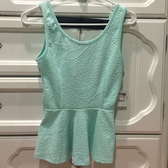 Textured peplum top with bandaged back
