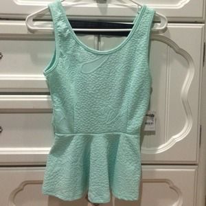 Textured peplum top with bandaged back