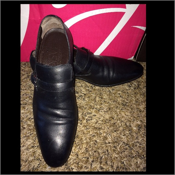 A. Testoni black leather shoe - male.