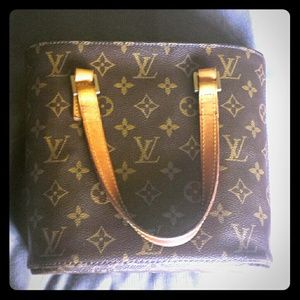 Small brown clutch. Authentic LV