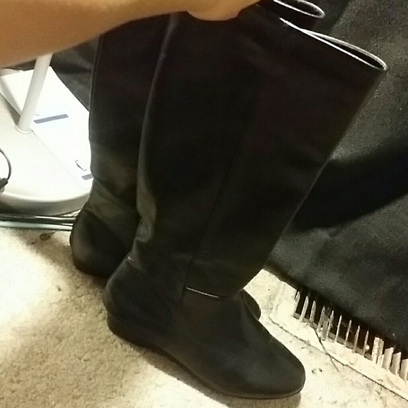 Tall black boots.
