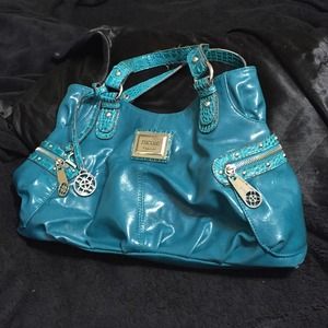 Beautiful teal purse with tons of pockets