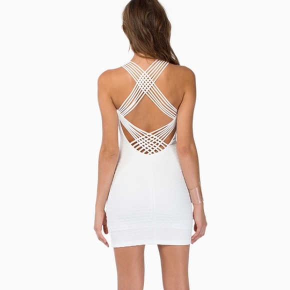White body con dress with a strappy back.