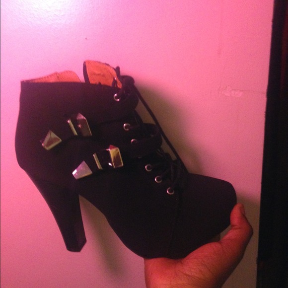 Black boots with silver buckles