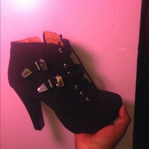 Black boots with silver buckles