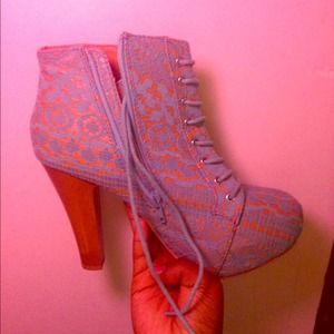 Teal colored laced boots