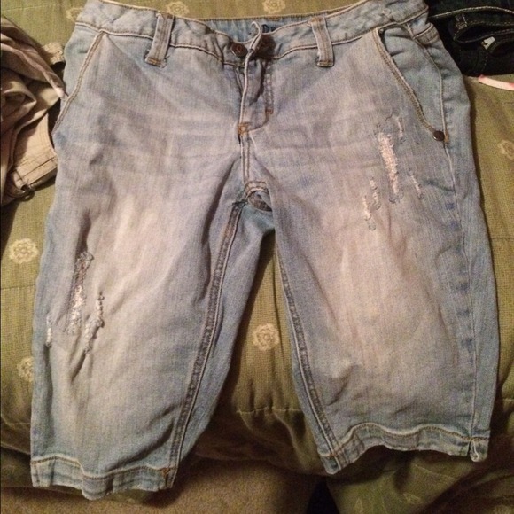 Light blue knee length shorts.