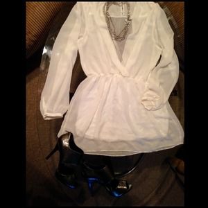 White long sleeved deep V dress