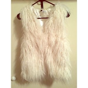 White fur vest