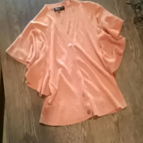 Sweet orange v neck, cardigan style sweater!