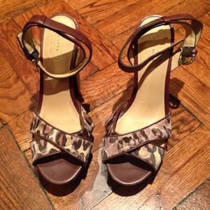 Never worn coach leopard platform heels.