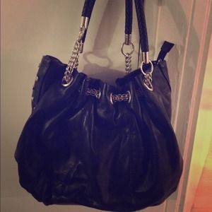 Metal stud side detail Black faux leather handbag