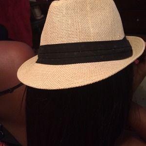 Tan hat with black stripe