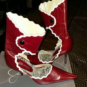 Very stylish  dark red pump with snap ankle wrap.