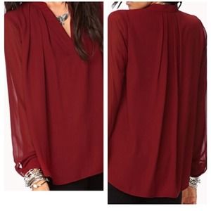 Pleated A-Line top with sheer sleeve detail.