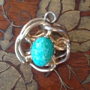 Gold tone two sided medallion w/faux green stone