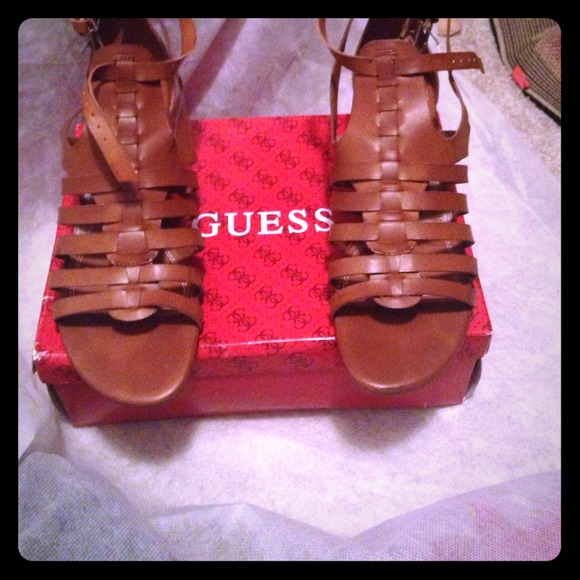 Brown sandals by Guess