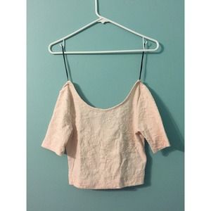 Textured pink crop top.