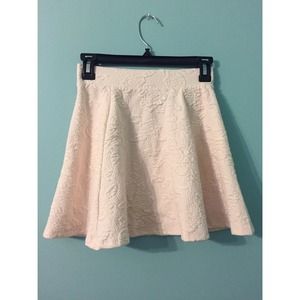 Textured pink skater skirt.