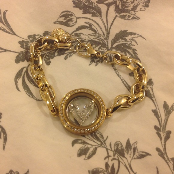 Origami owl bracelet . Gold hardware.