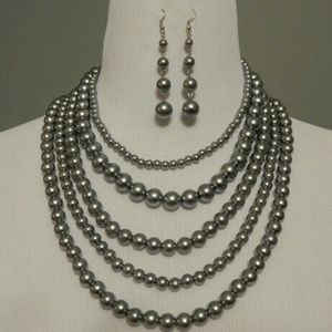 Silver multi strand necklace with earrings.