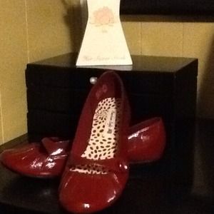 American Eagle red slip shoes.