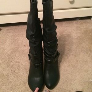 Tall black high heeled boots