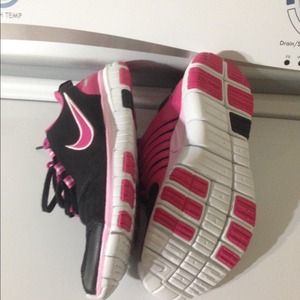 Never worn black and pink Nike free shoes