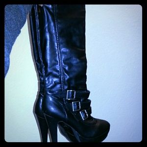 Black up to the knee buckled boots