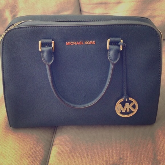 Michael Kors blue bag.