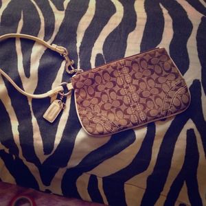 Coach brown, tan and white wristlet