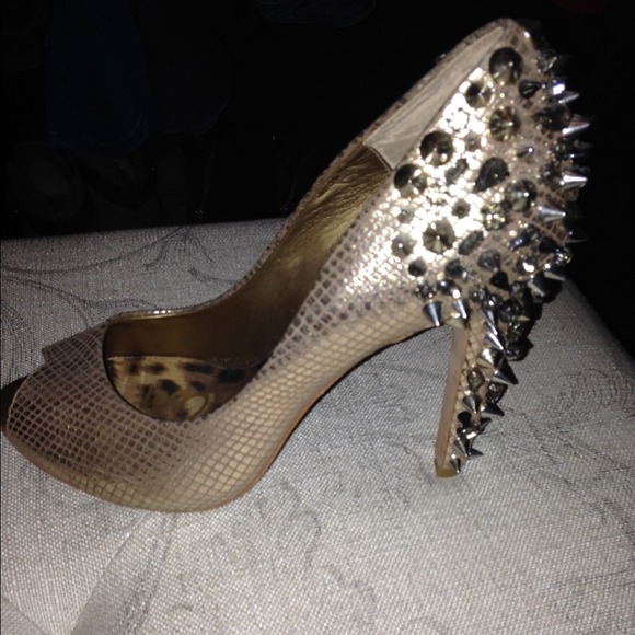 Gold spiked pumps
