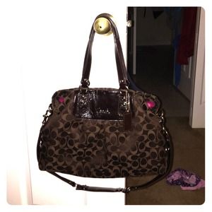 Dark brown coach bag with hot pink interior