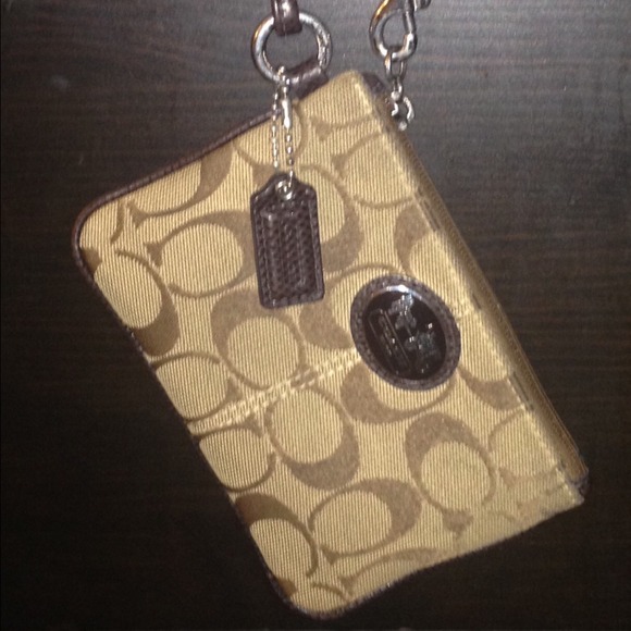 Coach brown wristlet.