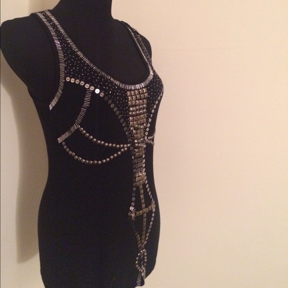 Black sequenced top. Decorative pattern