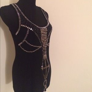 Black sequenced top. Decorative pattern