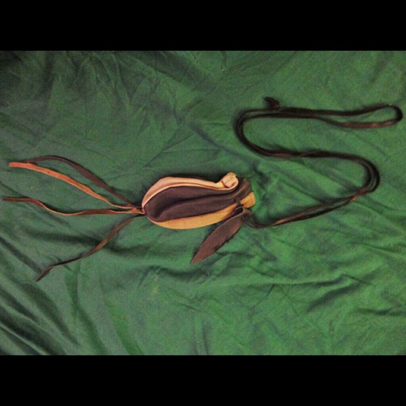 Handmade leather drawstring pouch.