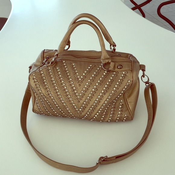 Gold large studded purse.
