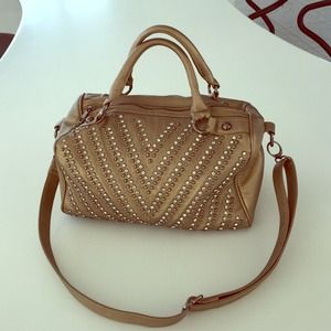 Gold large studded purse.