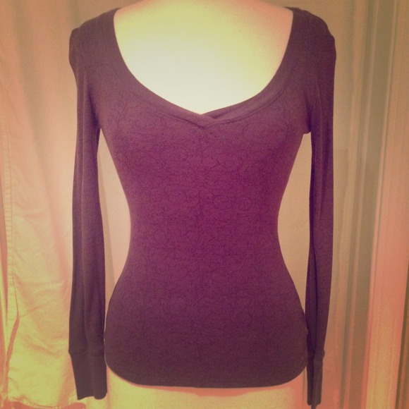 Purple long sleeved top with subtle design