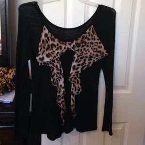 Black thin sweater with leopard bow on back. Nwot