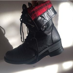 Black combat boots with plaid inside