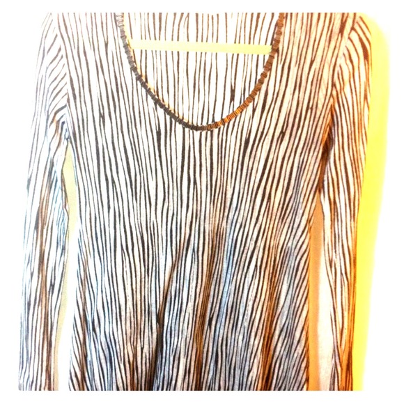 Flowy black and white top with cool hardware.