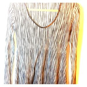 Flowy black and white top with cool hardware.