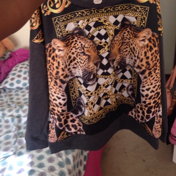 A Cheetah with Gold Chains and Design around It