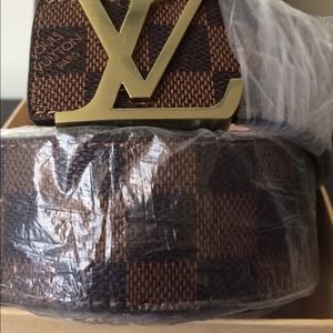 Brown belt with gold belt buckle